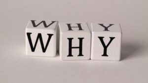 the word why made with cubes with letters