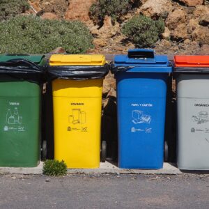 multi colored trash bins with designated labels